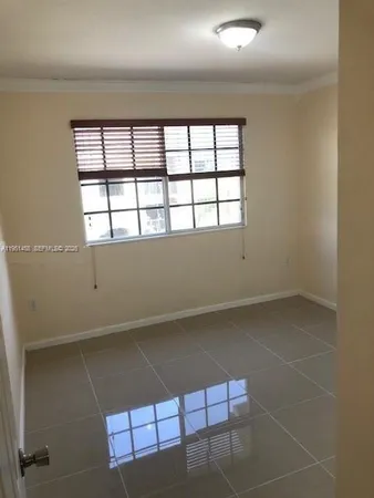 view of an empty room with a window
