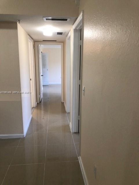 15430 Southwest 284th Street, Unit 6307 Homestead, FL 33033 - Photo 8 of 17 a view of a hallway