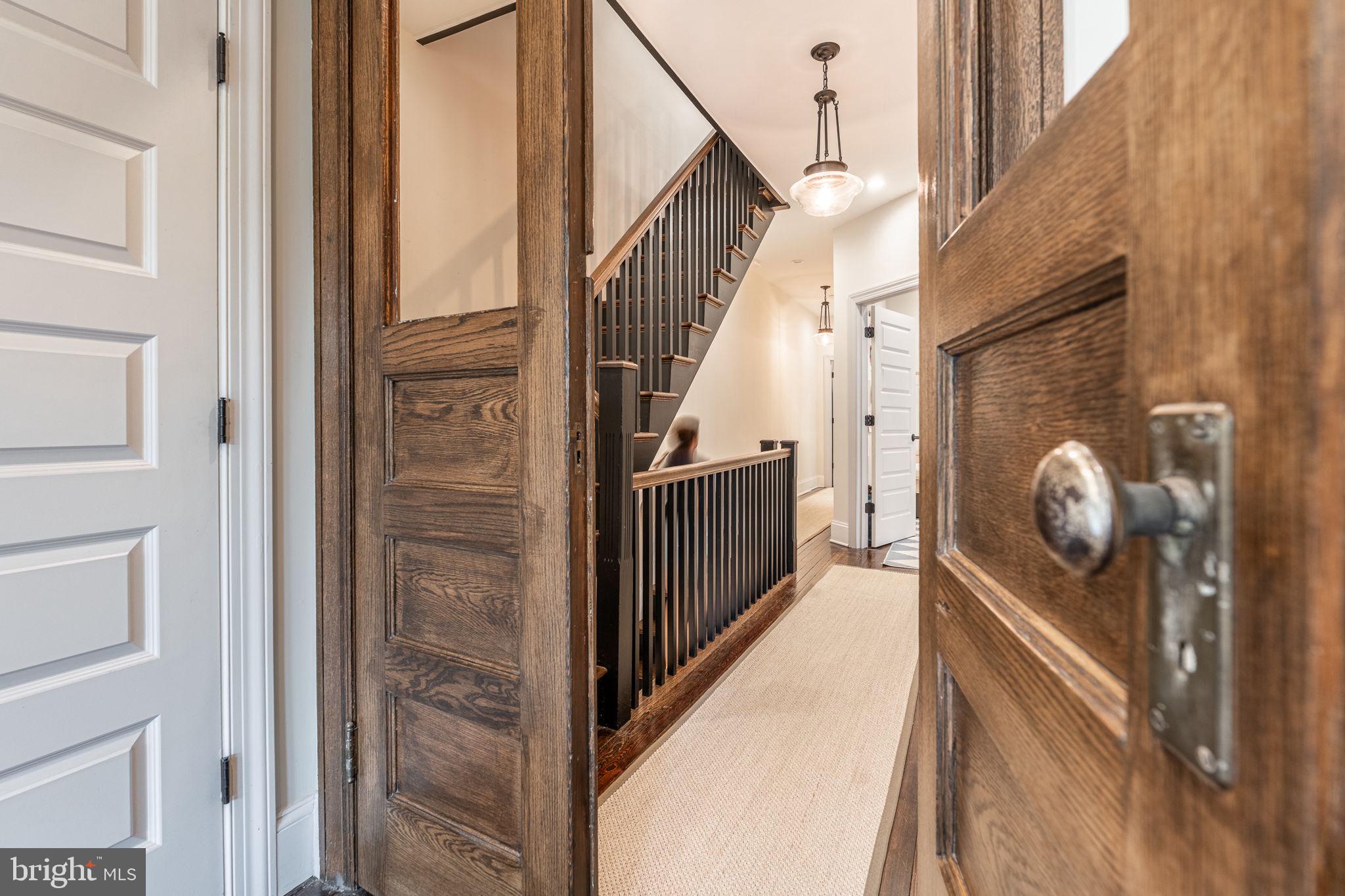 239 South 46th Street Philadelphia, PA 19139 - Photo 13 of 34 a view of a hallway with wooden floor and staircase