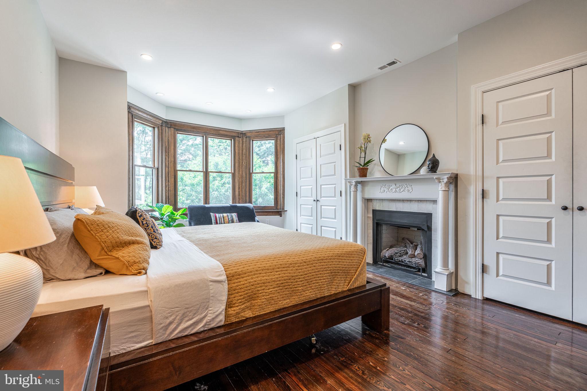 239 South 46th Street Philadelphia, PA 19139 - Photo 14 of 34 a bedroom with a bed and wooden floor