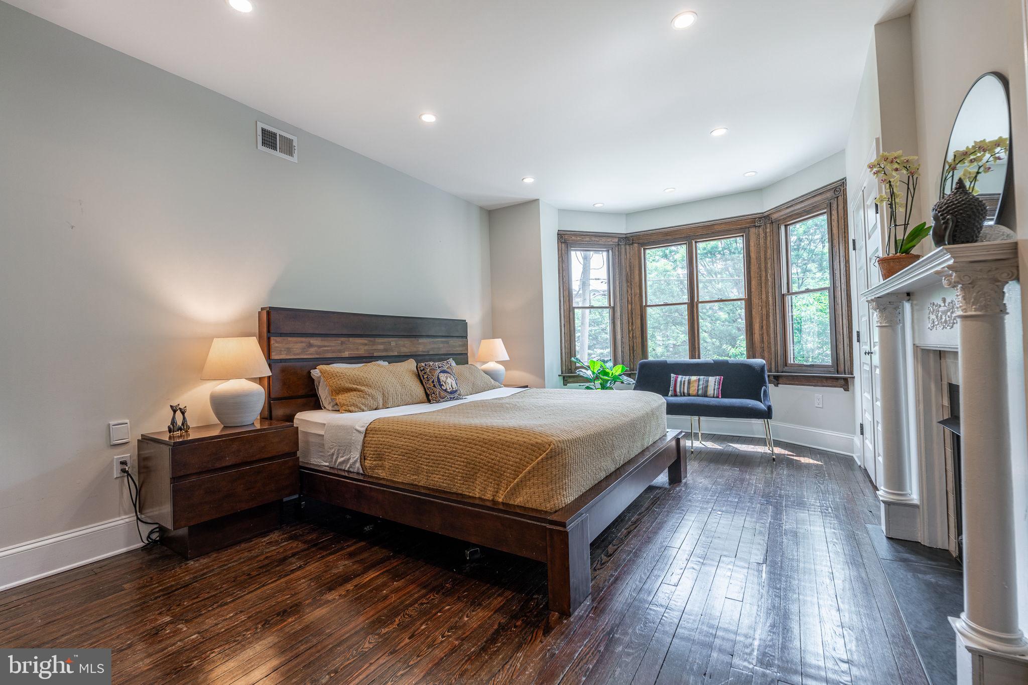 239 South 46th Street Philadelphia, PA 19139 - Photo 15 of 34 a bedroom with a bed and a large window