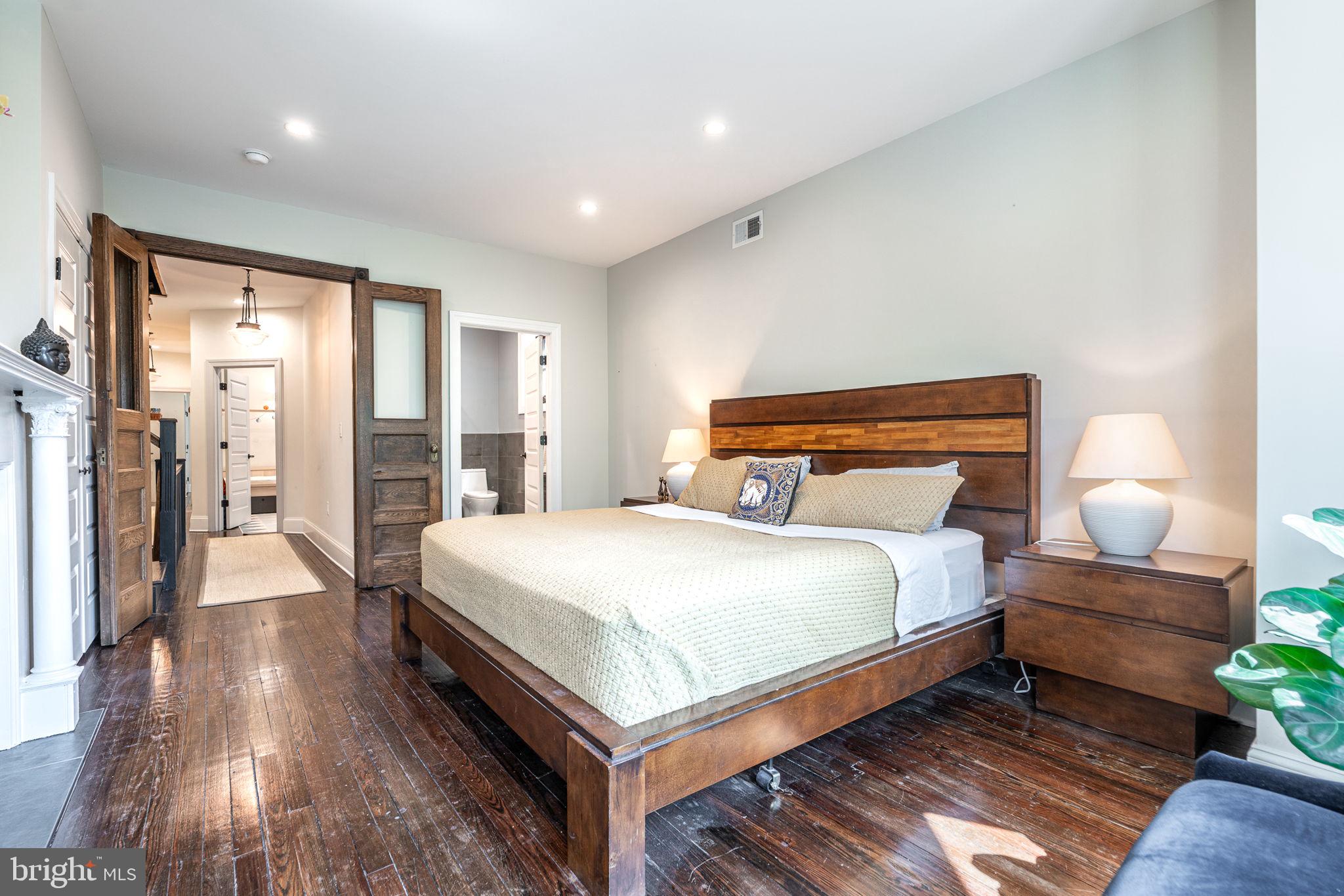 239 South 46th Street Philadelphia, PA 19139 - Photo 16 of 34 a bedroom with bed and wooden floor