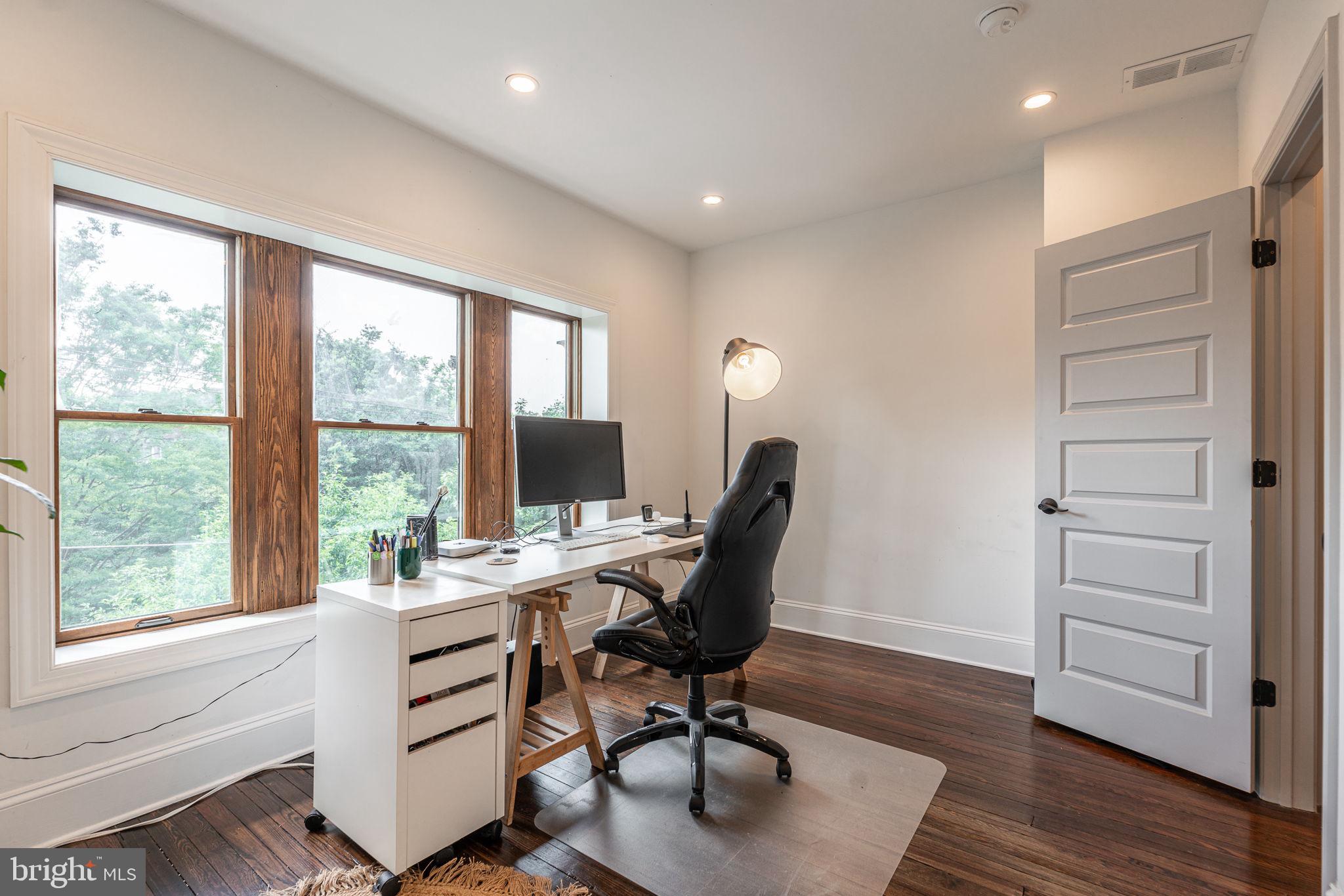 239 South 46th Street Philadelphia, PA 19139 - Photo 22 of 34 a view of a workspace with furniture and a window