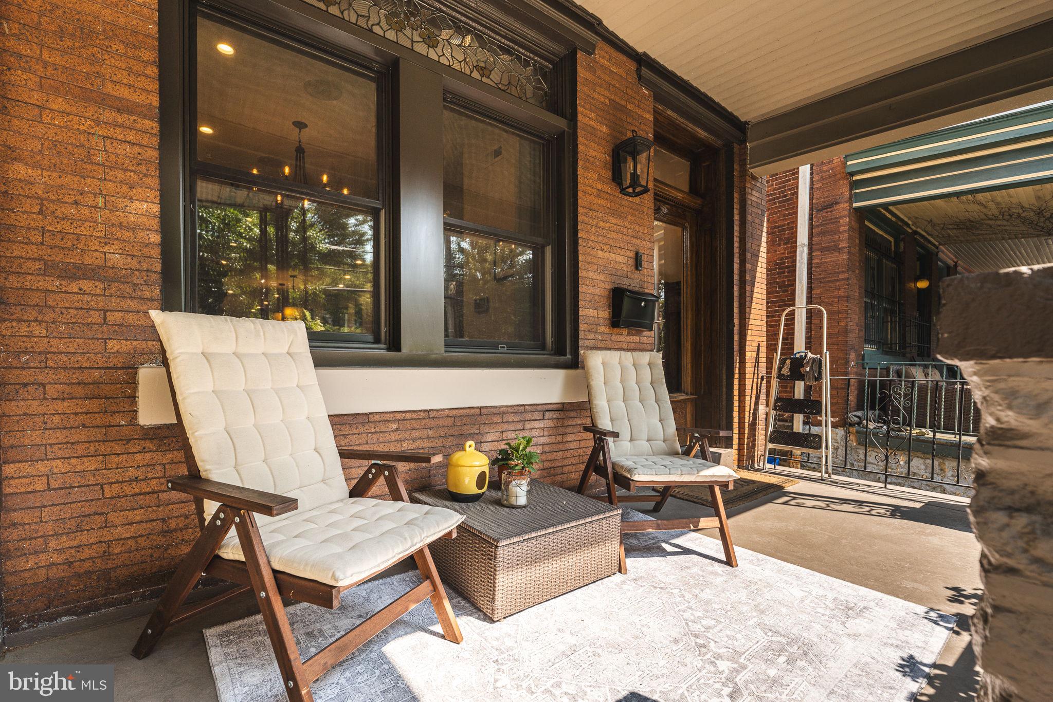 239 South 46th Street Philadelphia, PA 19139 - Photo 30 of 34 a view of a patio with table and chairs with wooden floor and plants