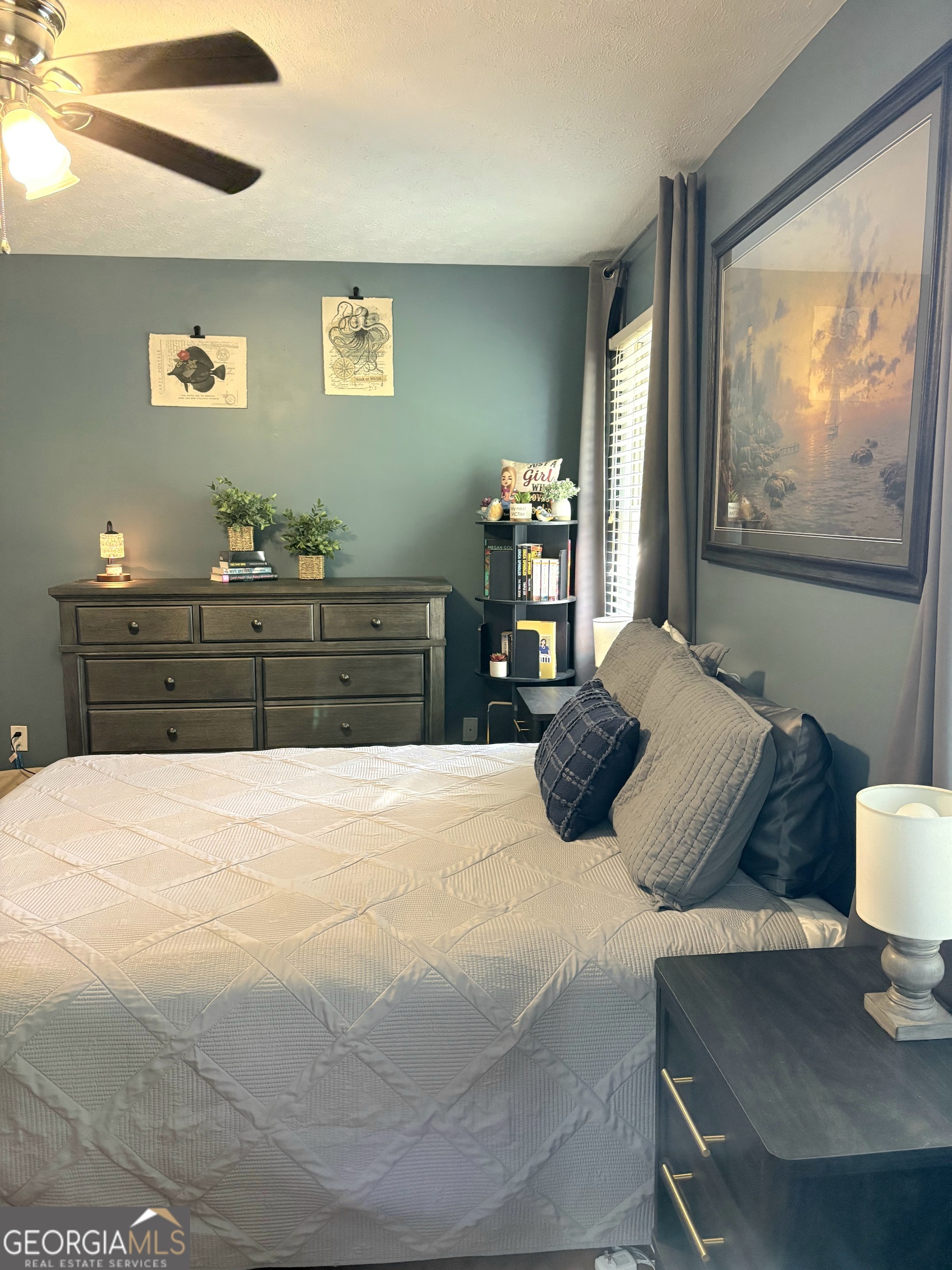 206 Oxford Road Griffin, GA 30223 - Photo 19 of 34 a bedroom with a bed and wooden floor