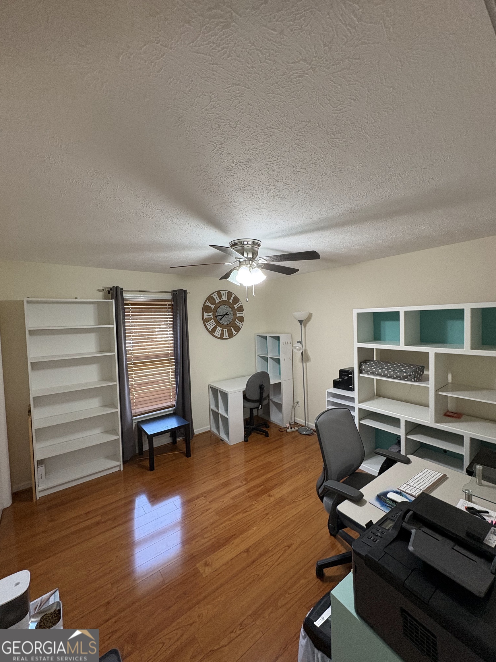 206 Oxford Road Griffin, GA 30223 - Photo 20 of 34 a workspace with furniture wooden floor and windows
