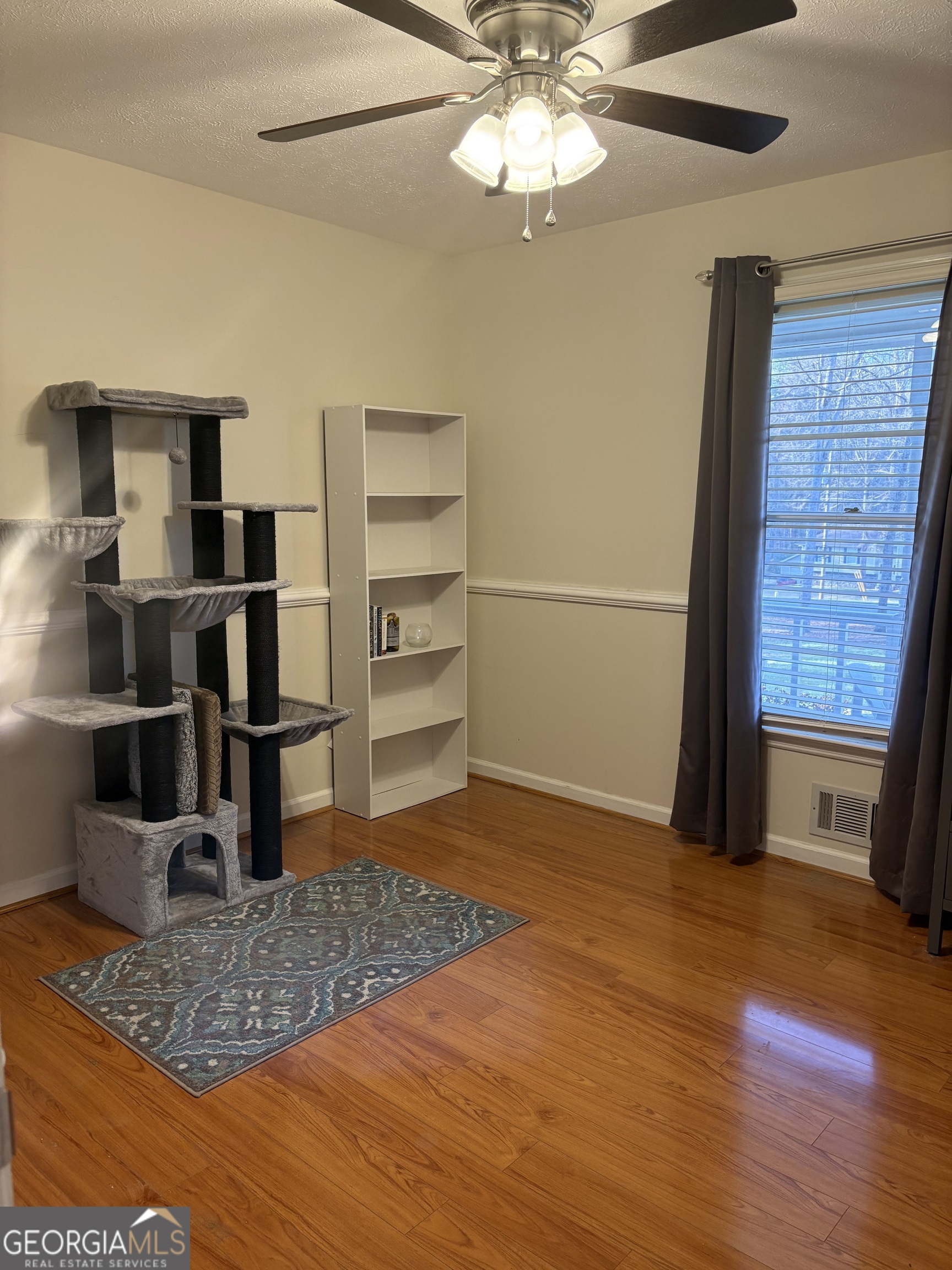 206 Oxford Road Griffin, GA 30223 - Photo 21 of 34 a view of a livingroom with furniture and an empty space