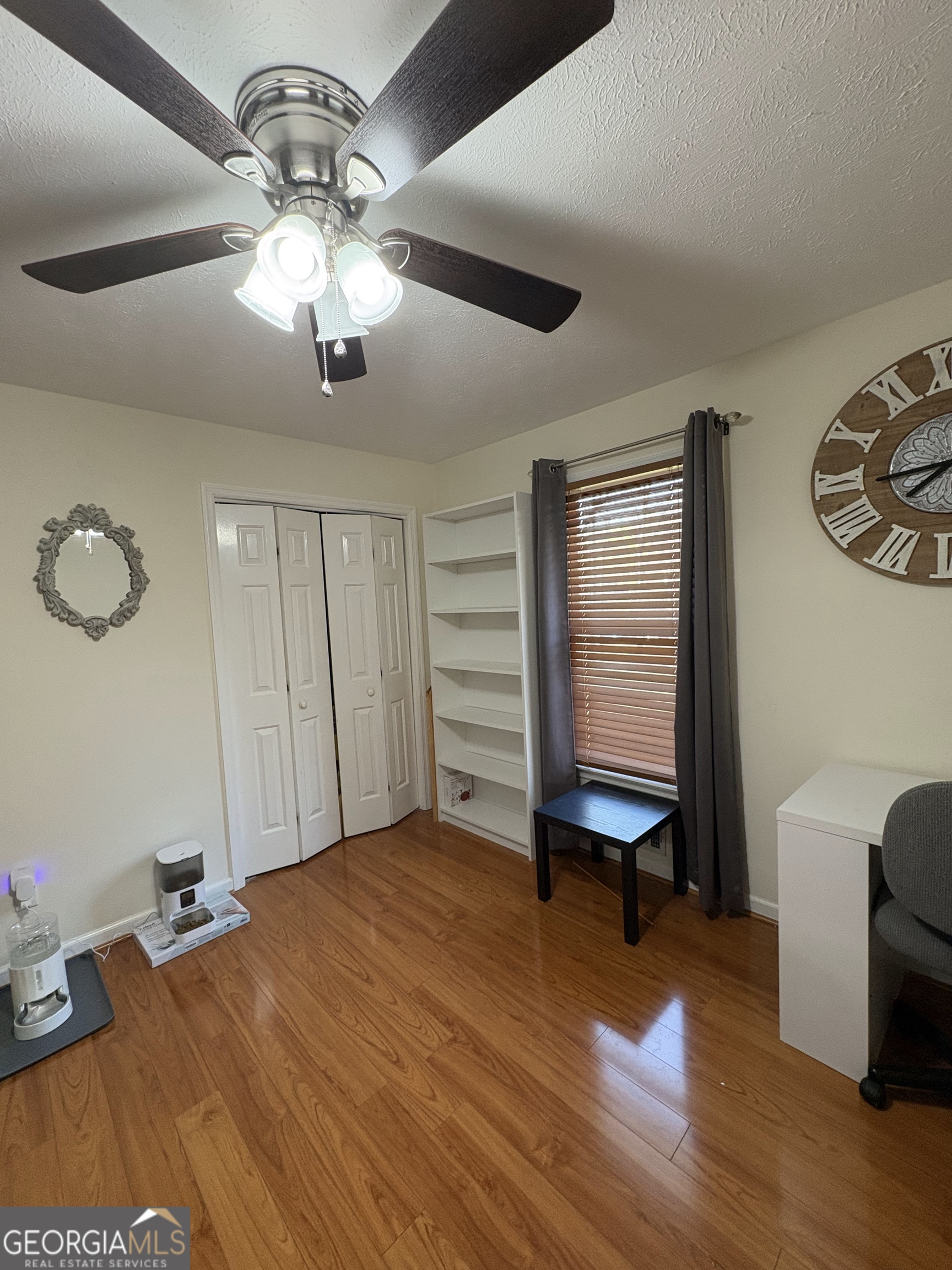 206 Oxford Road Griffin, GA 30223 - Photo 22 of 34 a bed room with a bed and a chair