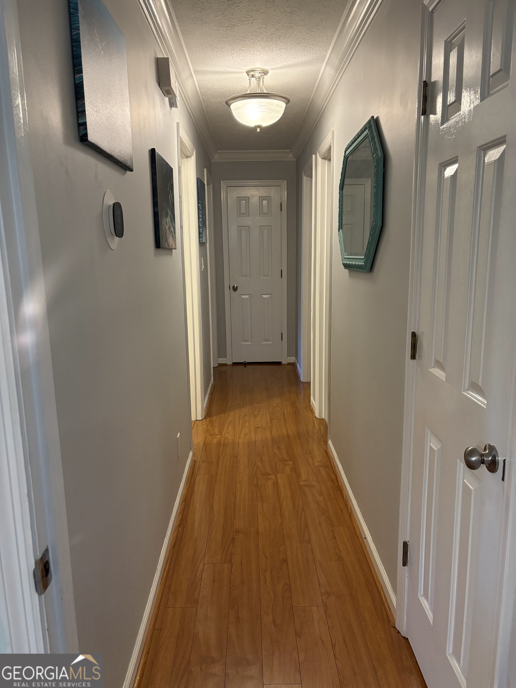206 Oxford Road Griffin, GA 30223 - Photo 28 of 34 a view of a hallway with wooden floor