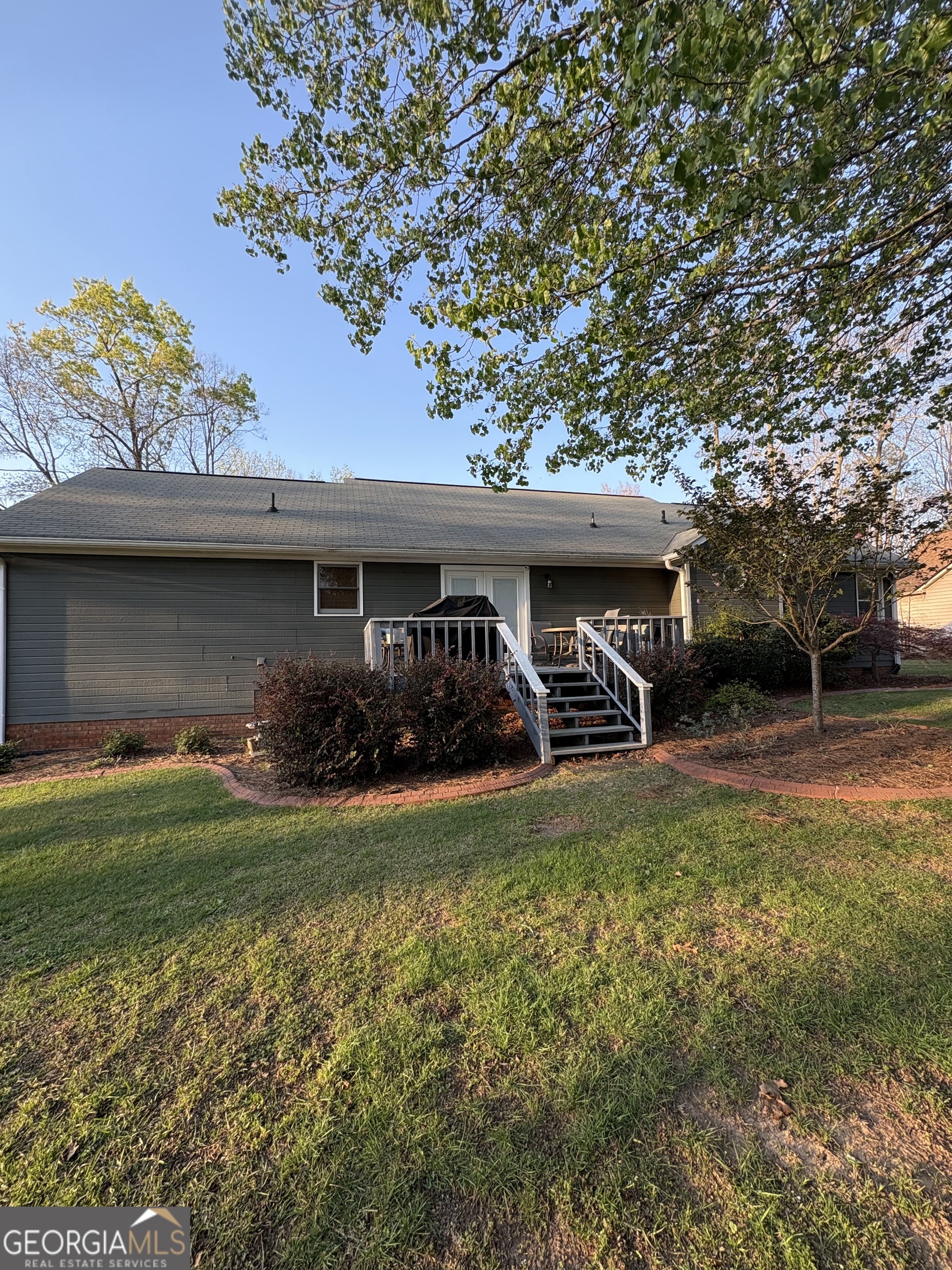 206 Oxford Road Griffin, GA 30223 - Photo 29 of 34 a view of a house with a yard porch and sitting area