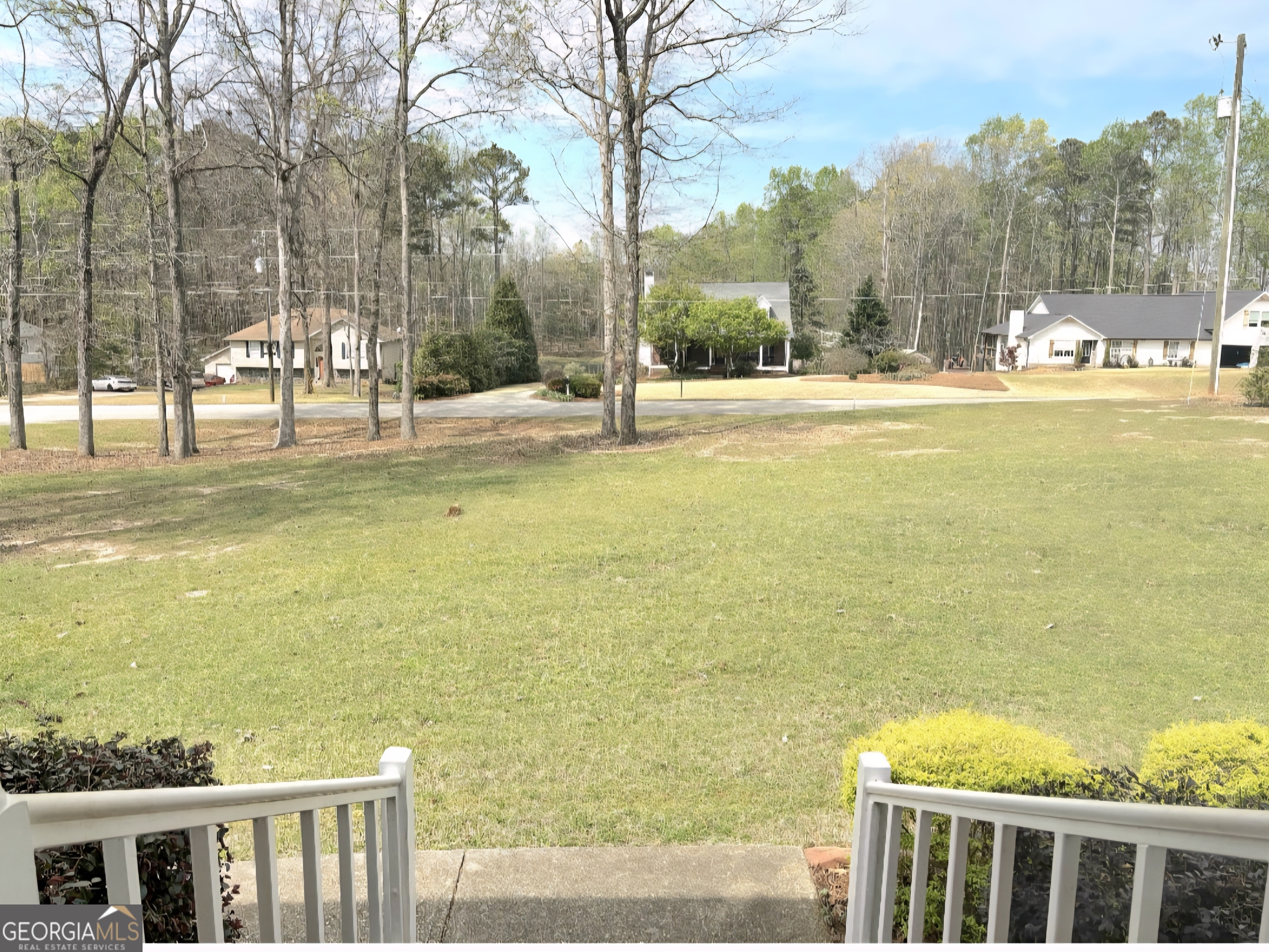 206 Oxford Road Griffin, GA 30223 - Photo 6 of 34 a view of an ocean with a building and trees in the background