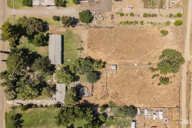 a view of sink with large trees