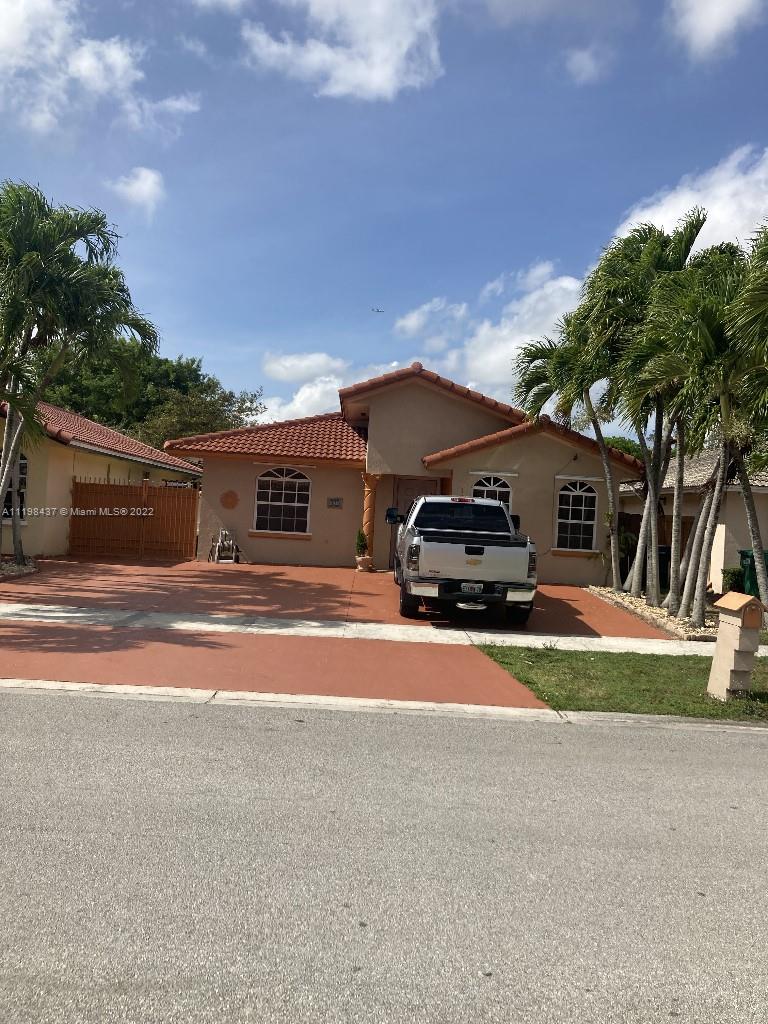 14113 Southwest 9th Street Miami, FL 33184 - Photo 1 of 1 a car parked in front of a house