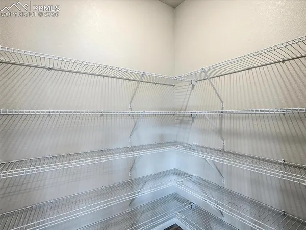 a view of a room with racks on the wall