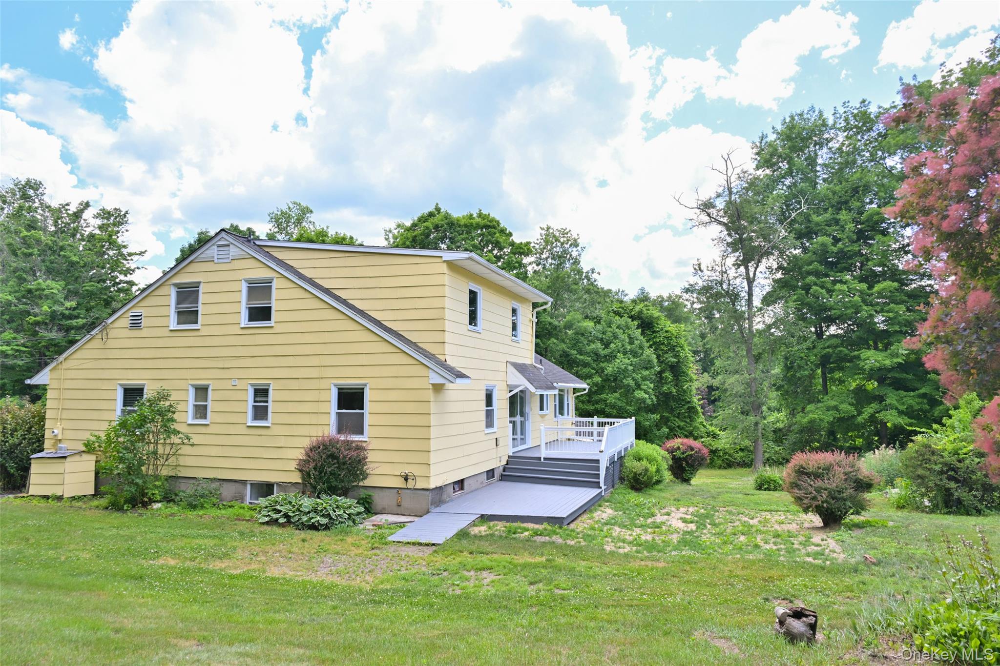 136 Foggintown Road Brewster, NY 10509 - Photo 45 of 50 a view of a house with a backyard