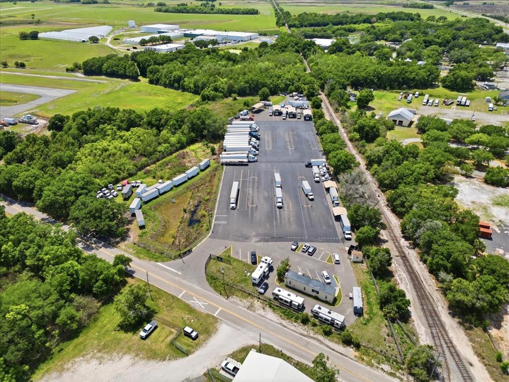 100 South Airport Road Lake Wales, FL 33859 - Photo 12 of 28 an aerial view of a house with a garden