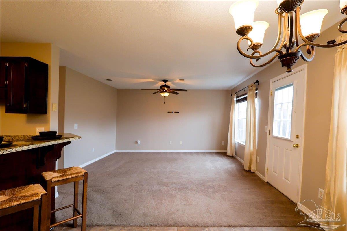 3256 Two Sisters Way Pensacola, FL 32505 - Photo 12 of 40 a view of a livingroom with a chandelier furniture and windows