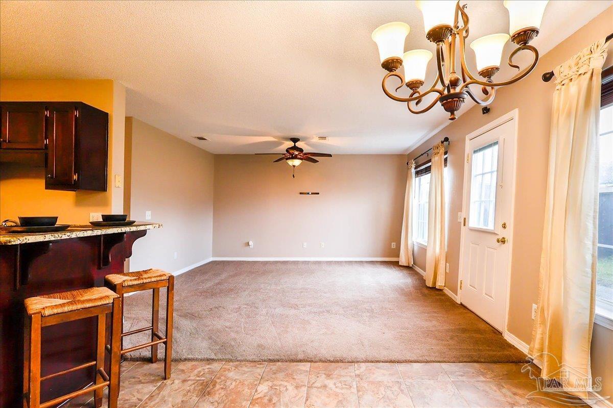 3256 Two Sisters Way Pensacola, FL 32505 - Photo 20 of 40 a view of a room with a chandelier furniture and windows