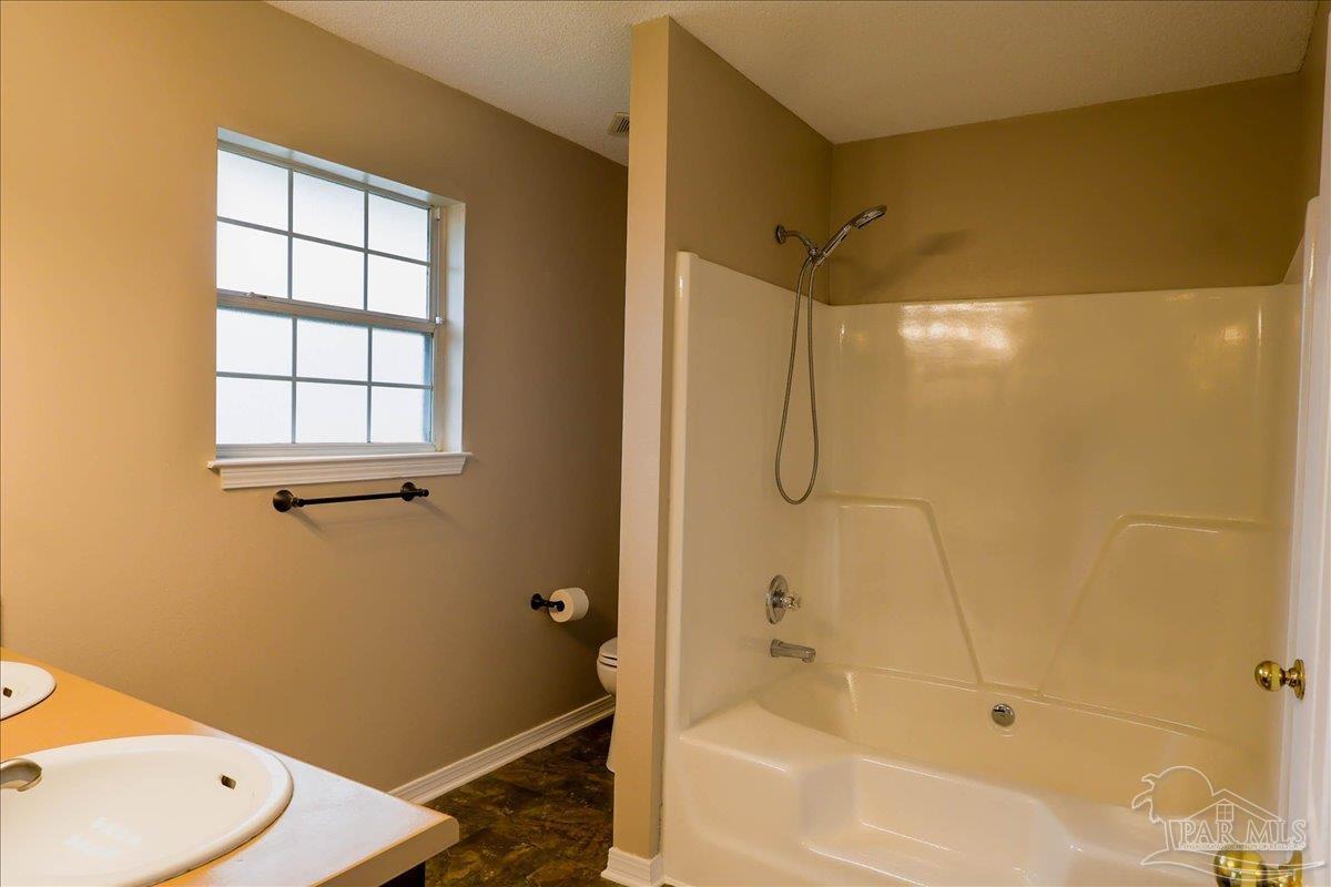 3256 Two Sisters Way Pensacola, FL 32505 - Photo 27 of 40 a bathroom with a shower and a bathtub