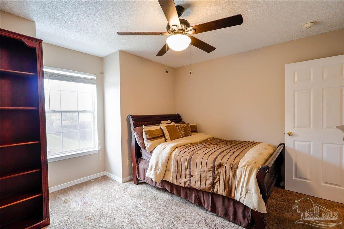 3256 Two Sisters Way Pensacola, FL 32505 - Photo 33 of 40 a bedroom with a bed and a window