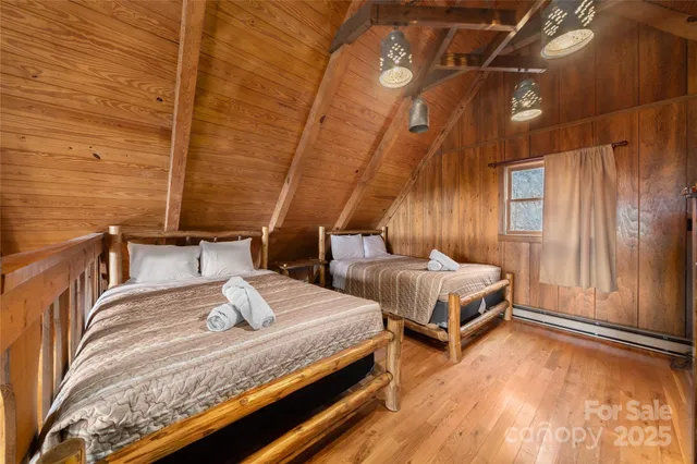 a bedroom with a bed and a view of balcony