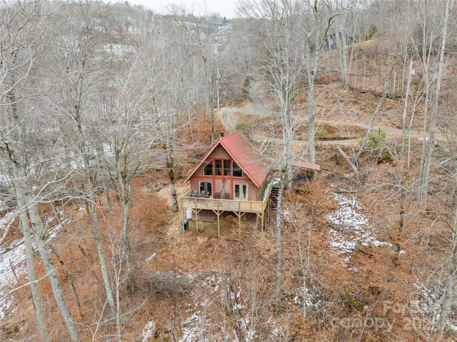 a roof view of a house with a yard