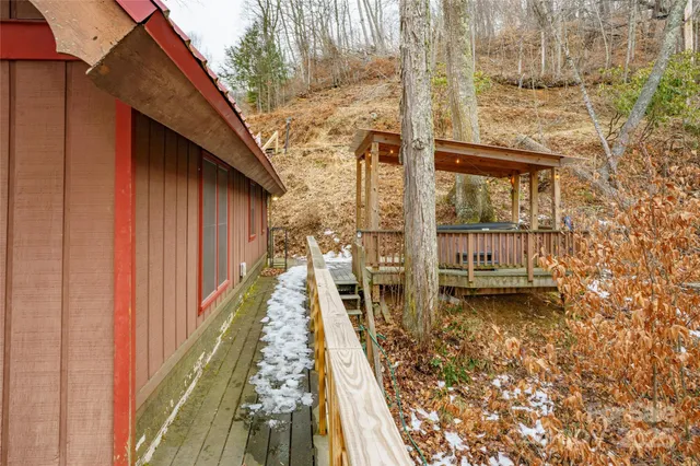 a view of balcony with furniture and wooden floor
