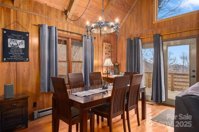 a view of a dining room with furniture window and outside view