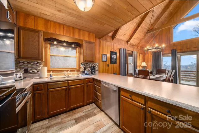 a large kitchen with lots of counter space and a sink