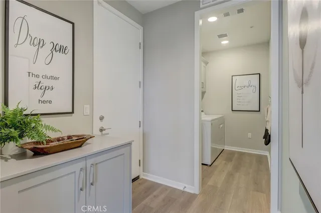 a bedroom with a bed and a potted plant