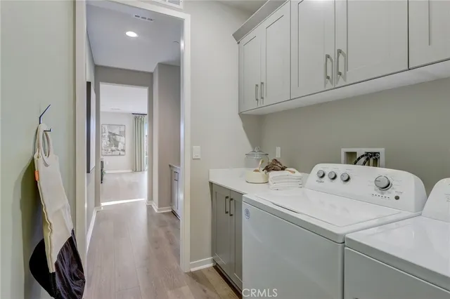 a bedroom with a bed and chandelier