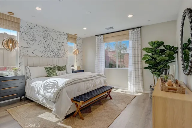 a bedroom with a bed and a mirror