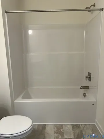 a bathroom with a sink toilet and a mirror