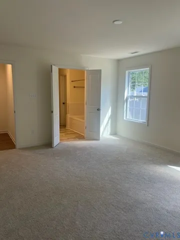 a bathroom with a shower and a toilet