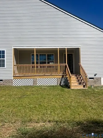 a view of a house with a patio and deck