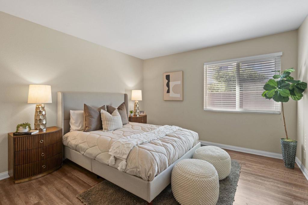 101 South Spruce Street, Unit 232 Escondido, CA 92025 - Photo 19 of 33 a bedroom with bed and a potted plant