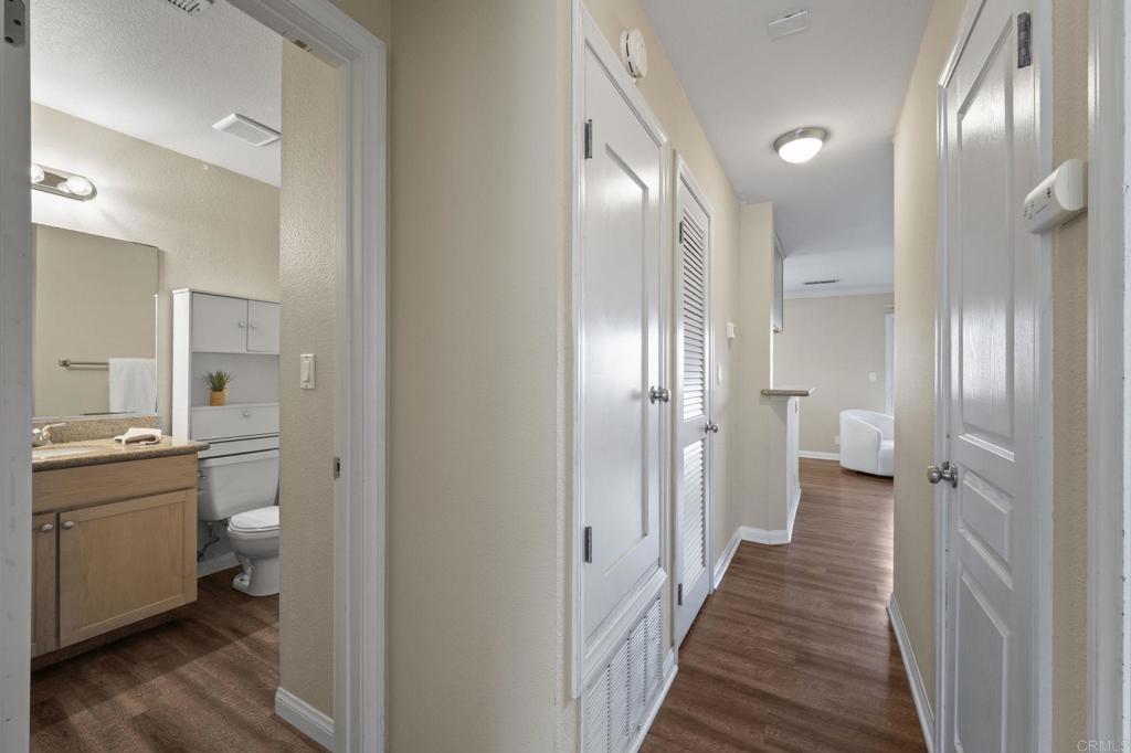101 South Spruce Street, Unit 232 Escondido, CA 92025 - Photo 20 of 33 a bathroom with a double vanity sink and a mirror