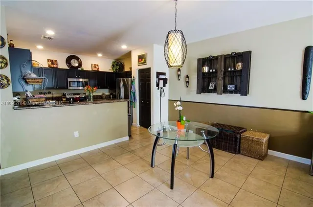 a view of kitchen with cabinets and outdoor space
