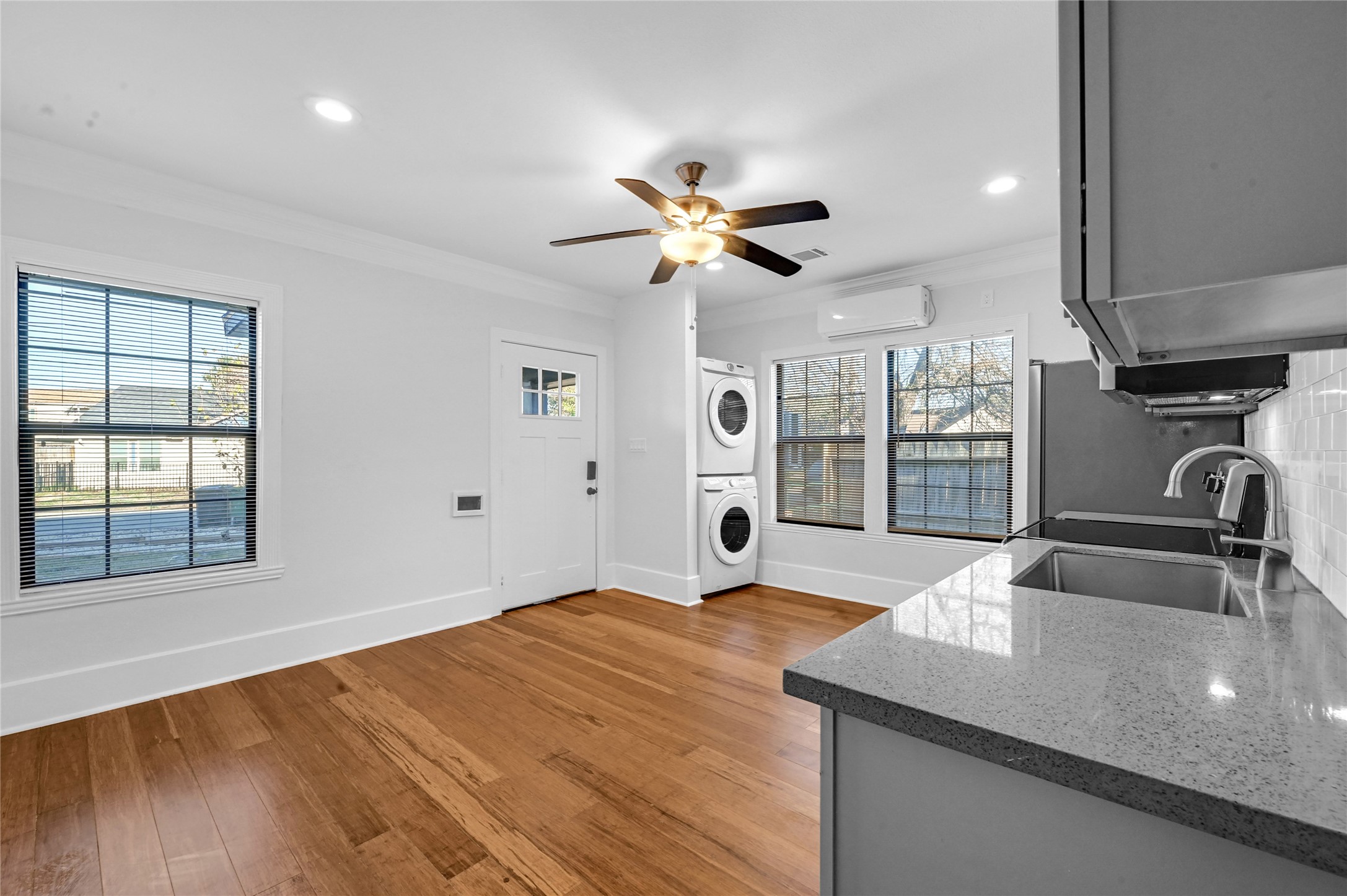 1633 Fourcade Street, Unit A Houston, TX 77023 - Photo 1 of 7 a kitchen with stainless steel appliances granite countertop a sink a stove and a granite counter tops with a large window