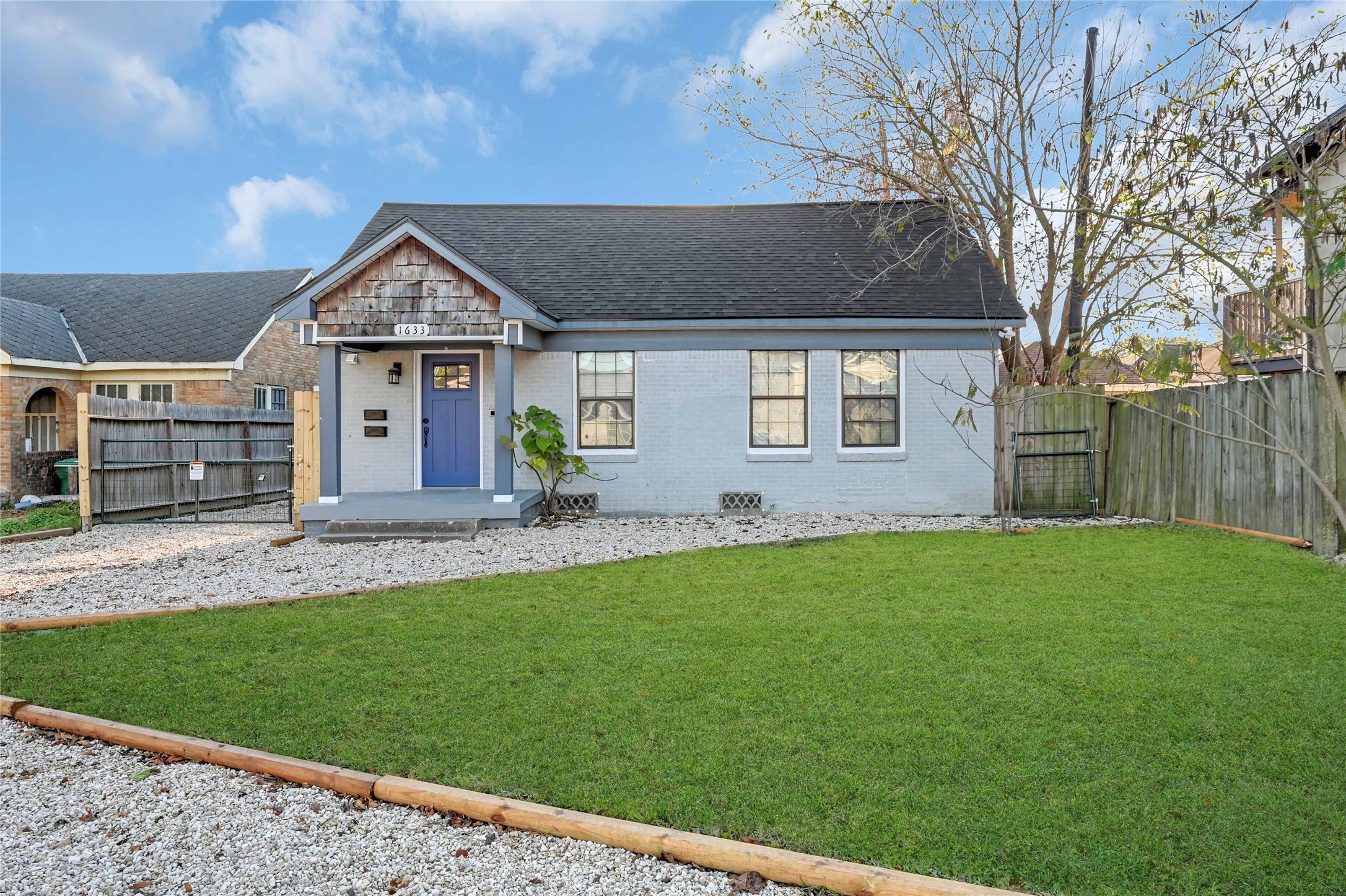 1633 Fourcade Street, Unit A Houston, TX 77023 - Photo 3 of 7 a front view of a house with a yard