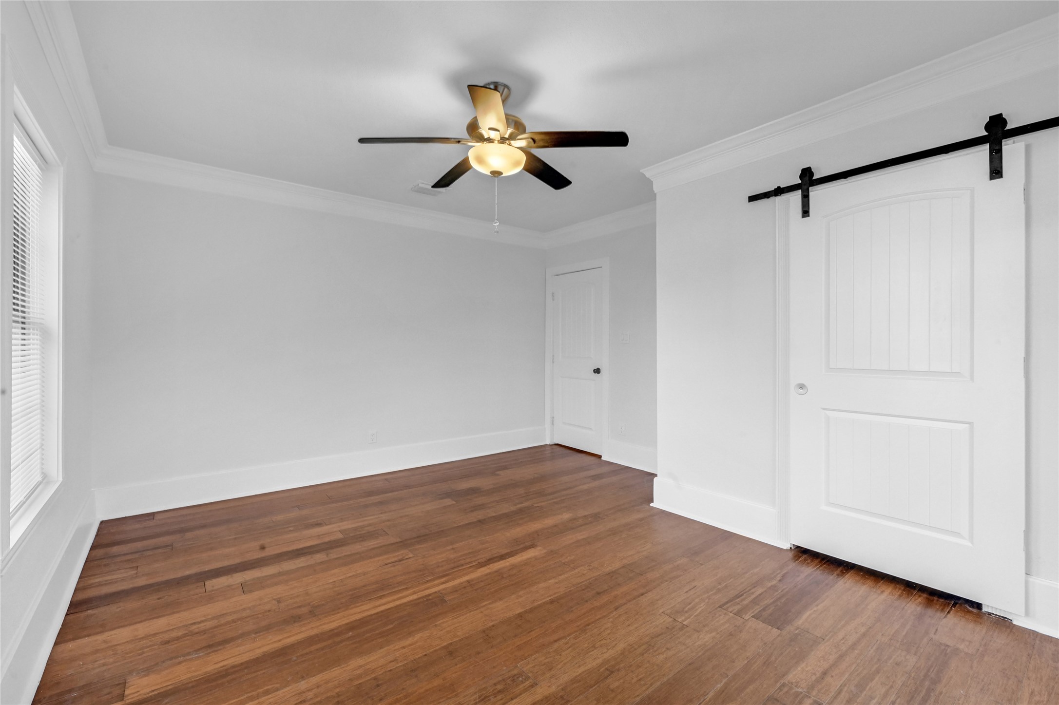1633 Fourcade Street, Unit A Houston, TX 77023 - Photo 4 of 7 a view of empty room with wooden floor