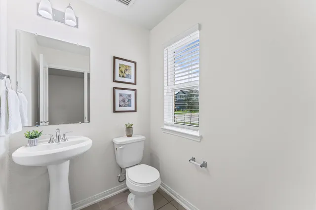 a view of kitchen with furniture and a refrigerator