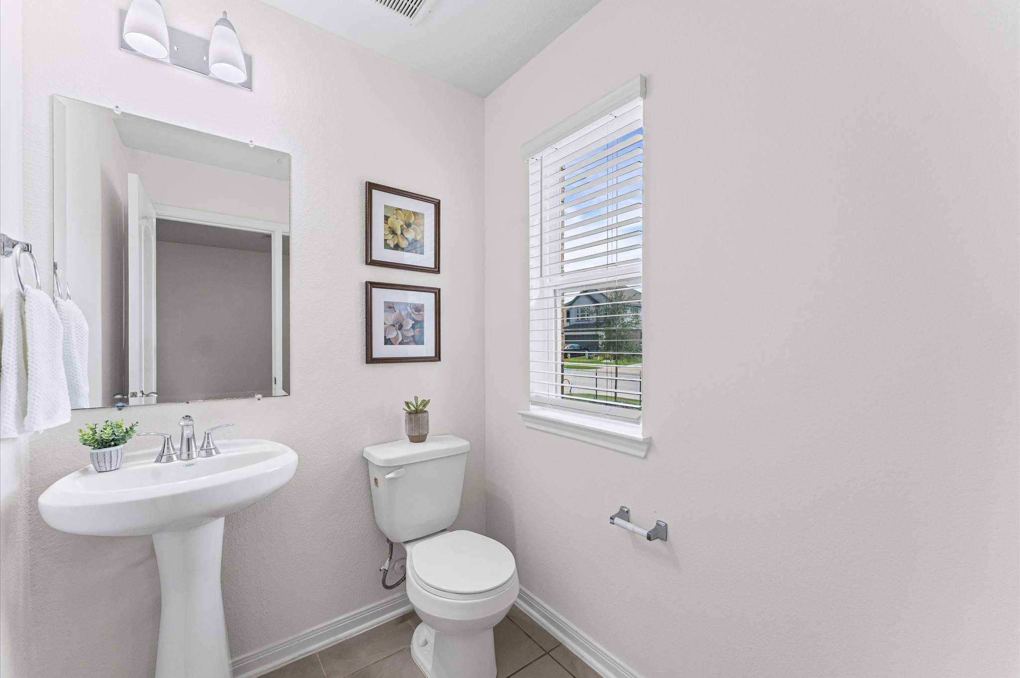 5031 Gazelle Leap Lane Richmond, TX 77406 - Photo 14 of 30 a bathroom with a sink toilet and a mirror