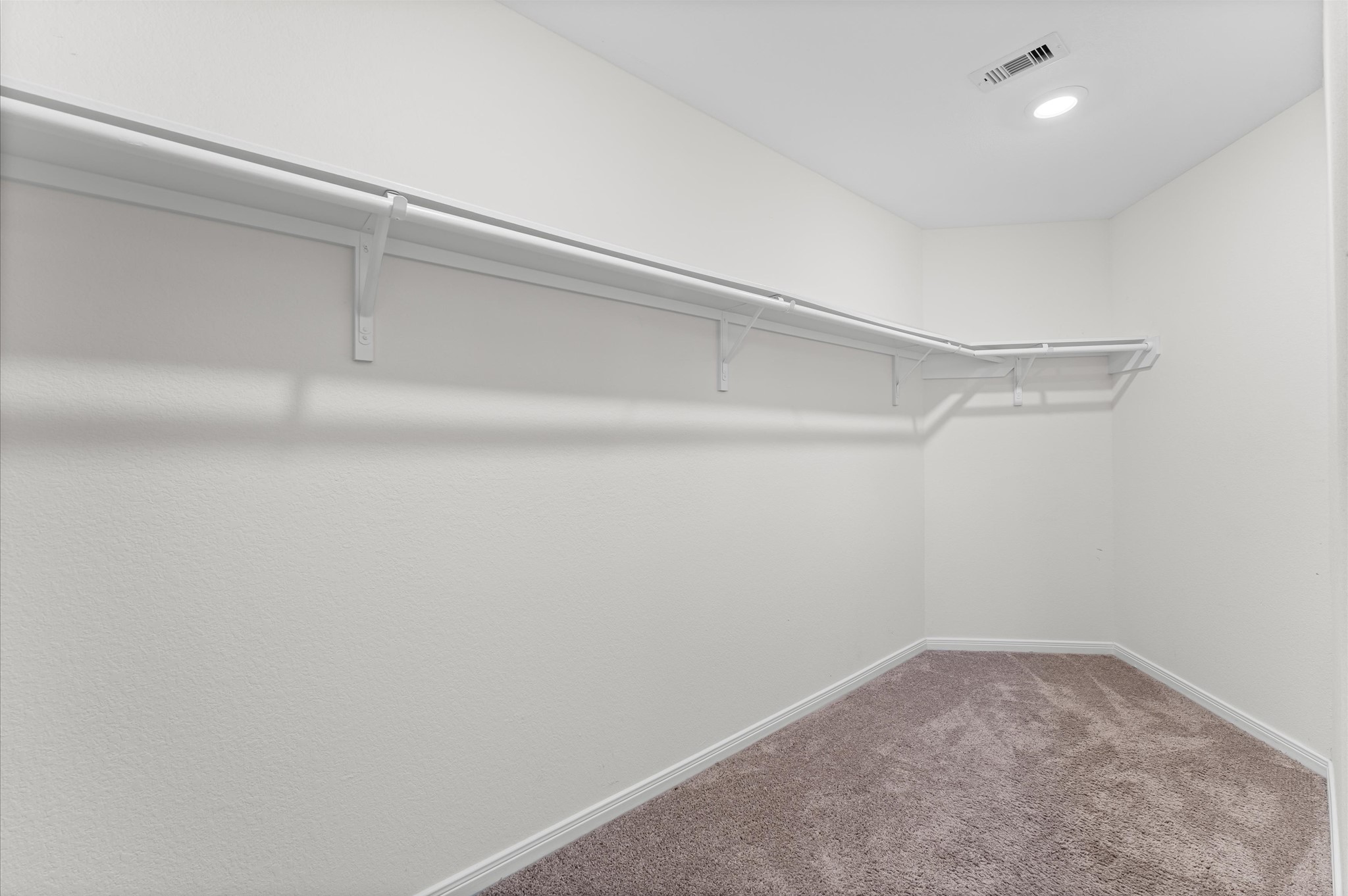 5031 Gazelle Leap Lane Richmond, TX 77406 - Photo 16 of 30 a view of a room with racks on the wall