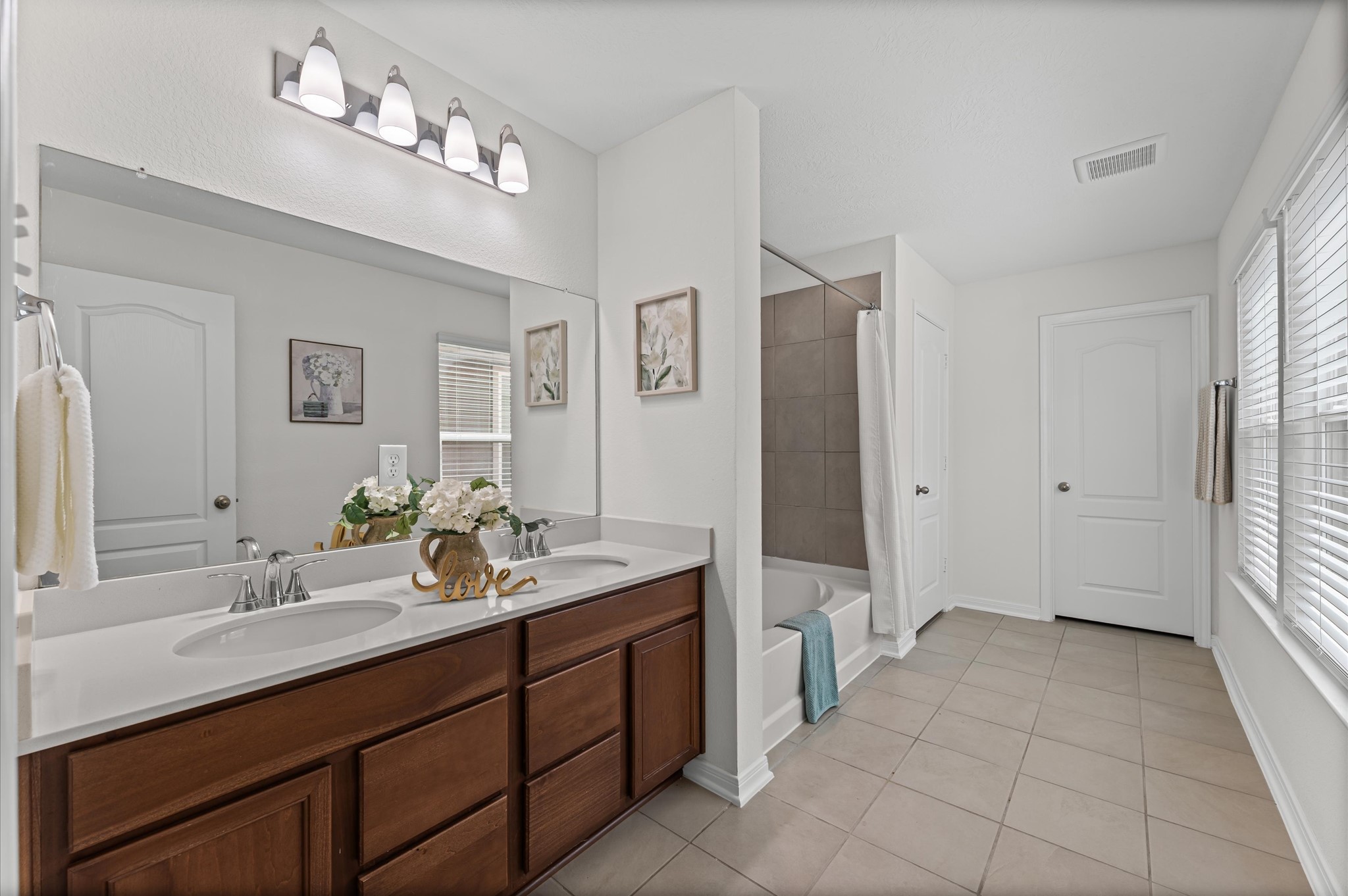 5031 Gazelle Leap Lane Richmond, TX 77406 - Photo 17 of 30 a spacious bathroom with a double vanity sink shower and a mirror