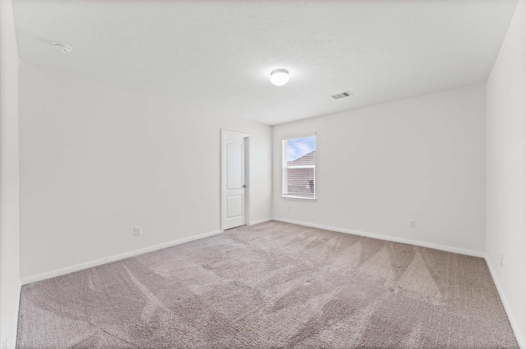 5031 Gazelle Leap Lane Richmond, TX 77406 - Photo 18 of 30 an empty room with windows