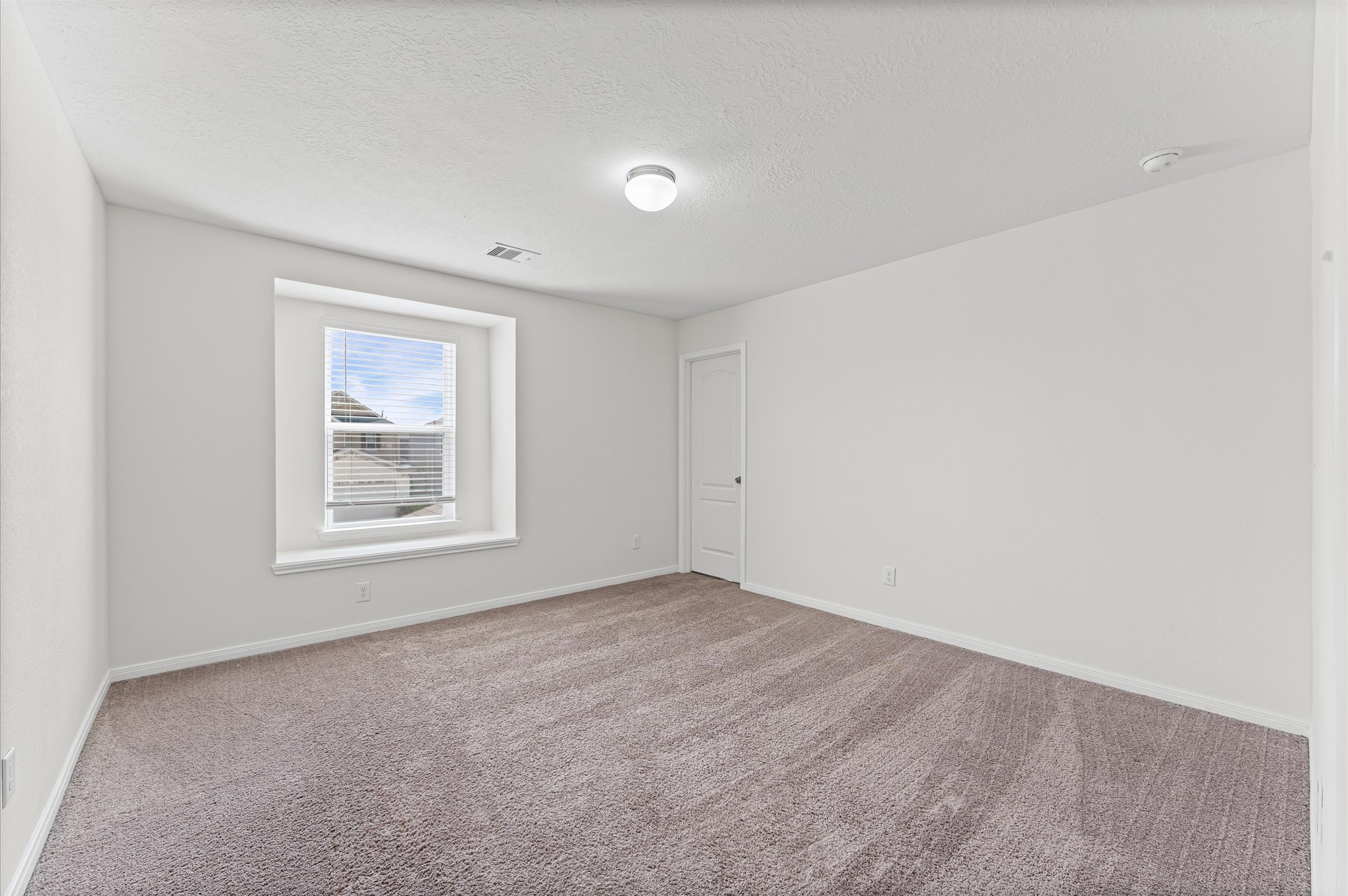 5031 Gazelle Leap Lane Richmond, TX 77406 - Photo 19 of 30 an empty room with a window