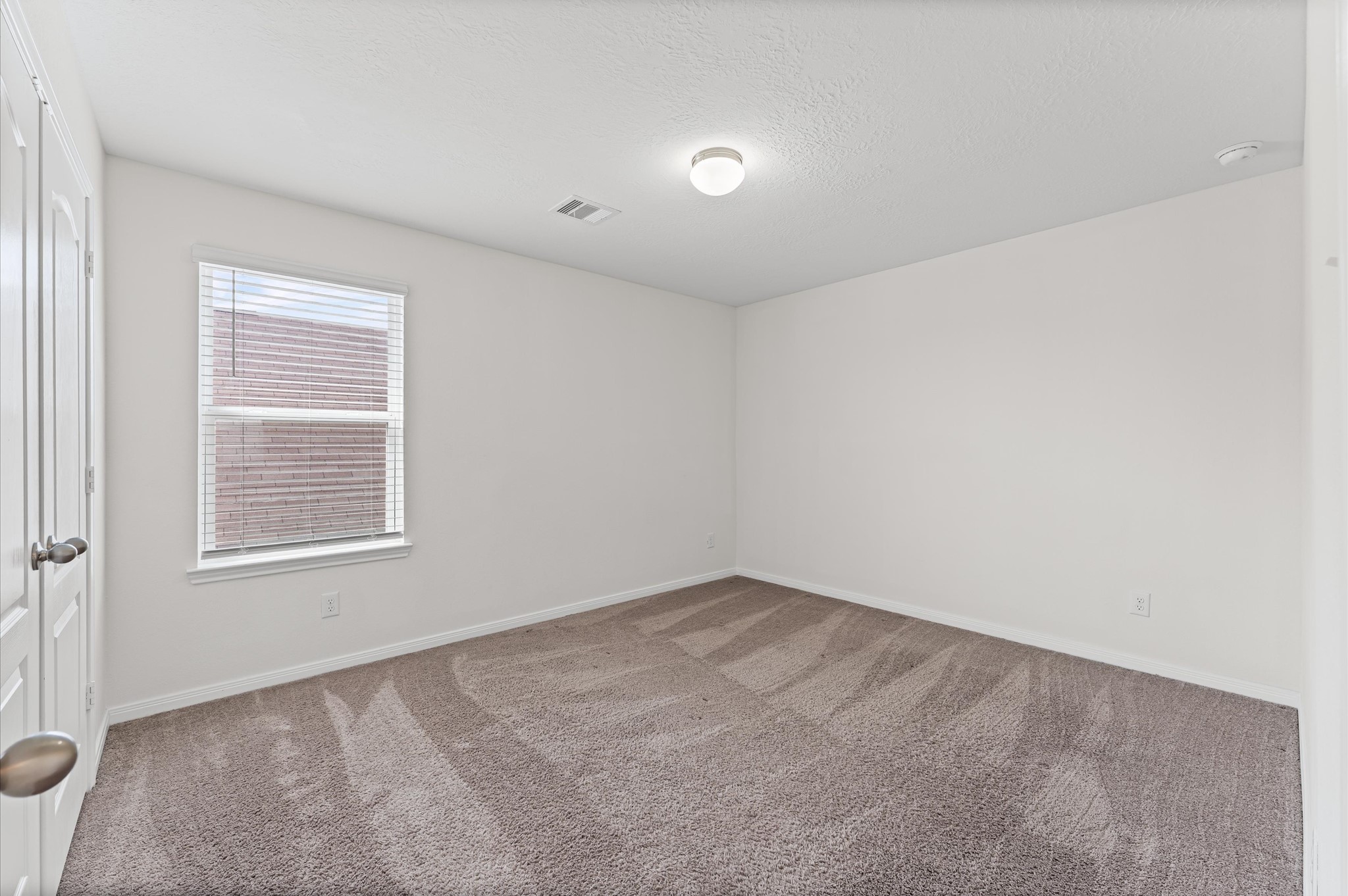 5031 Gazelle Leap Lane Richmond, TX 77406 - Photo 20 of 30 an empty room with a window