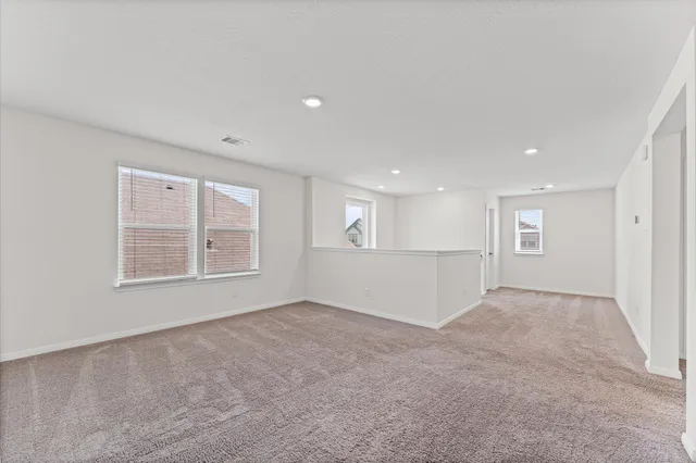 a bathroom with a double vanity sink a toilet and a mirror