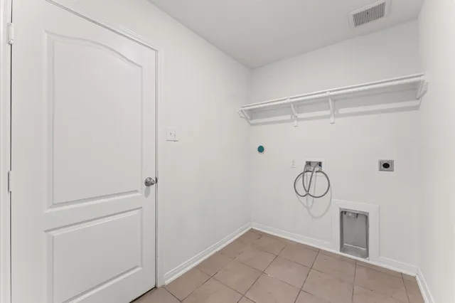 a view of a kitchen with white cabinets